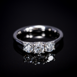 Round Brilliant Cut Diamond Three-Stone Ring in Platinum
